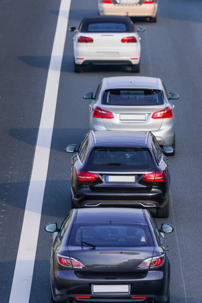istock Traffic jam on multiple lane highway cars in a row 816720798