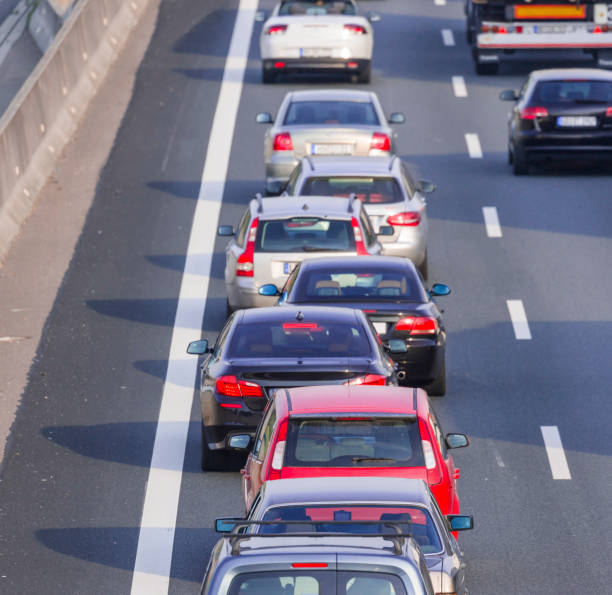 istock Traffic jam on multiple lane highway cars in a row 816725660