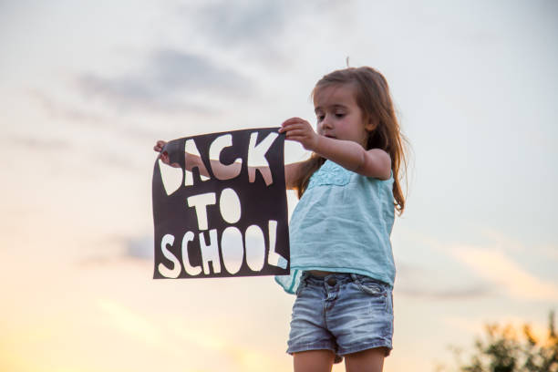 istock back to school girl on nature 816725976