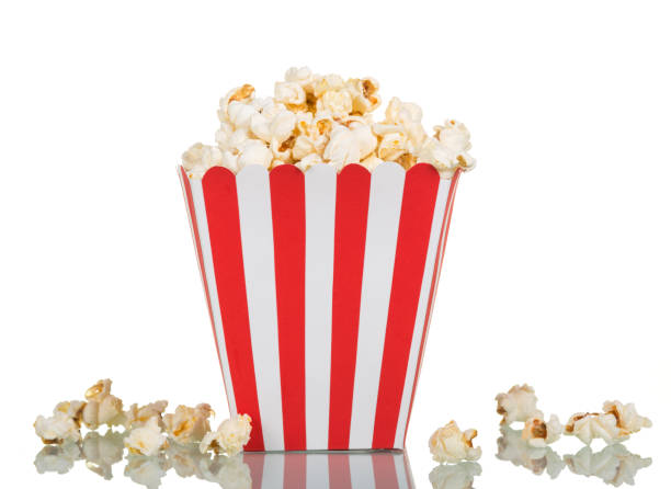 istock Popcorn in large square box and near isolated on white. 816736282