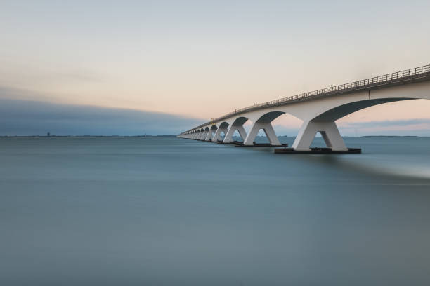 Long exposure photo of Zeeland bridge at sunset stock photo