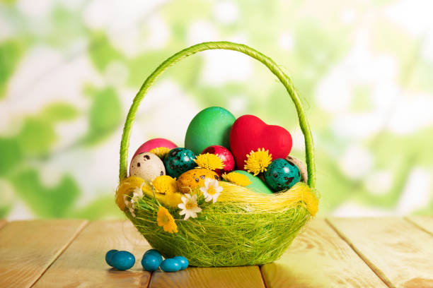 istock Easter eggs in basket, red hearts, flowers and candy. 816745706