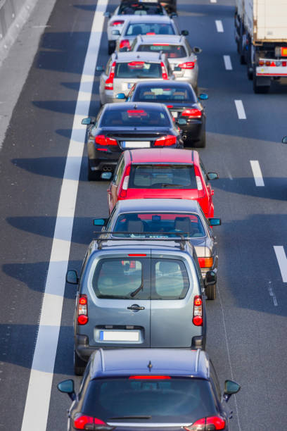 istock Traffic jam on multiple lane highway cars in a row 816752560