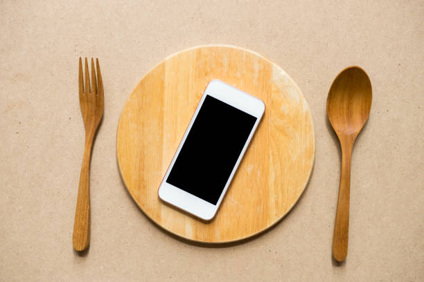 istock mobile phone served on wood plate, concept and idea 816758710