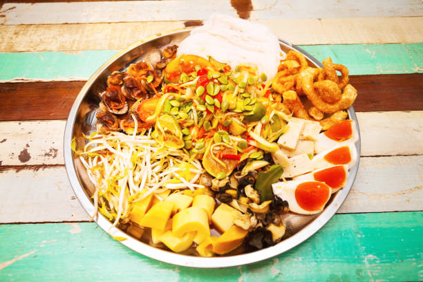 istock Som Tam with mixed vegetables, eggs, mussels and pork 816759056