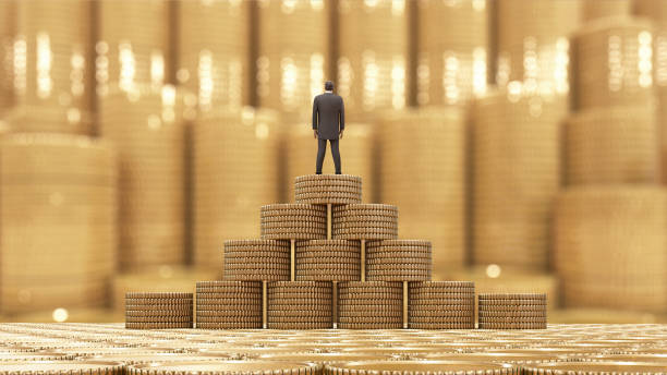 istock Businessman standing on a stack of coins 816759072