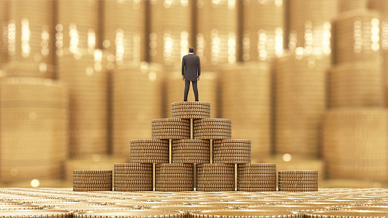 Businessman standing on a stack of coins.3d rendering