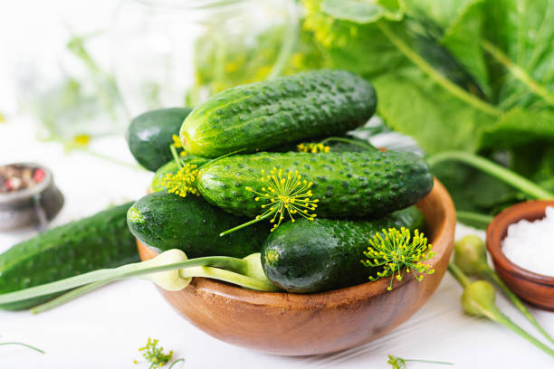 istock Preparation pickled marinated cucumbers, herbs and salt. 816759800