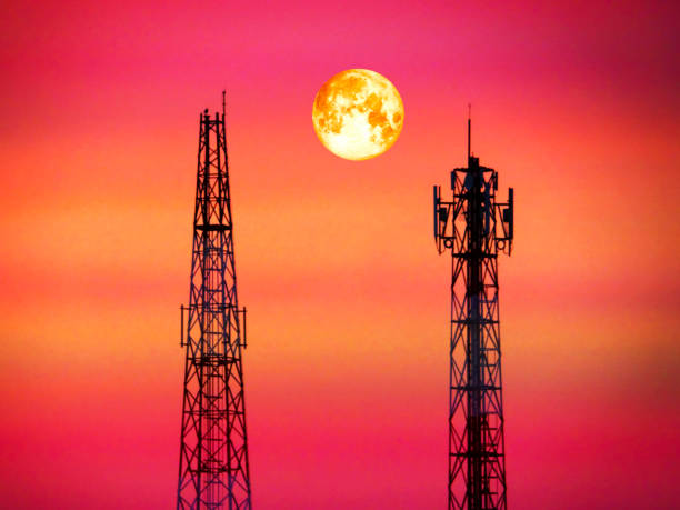 istock super blood moon between signal pillar in eveing light 816769298