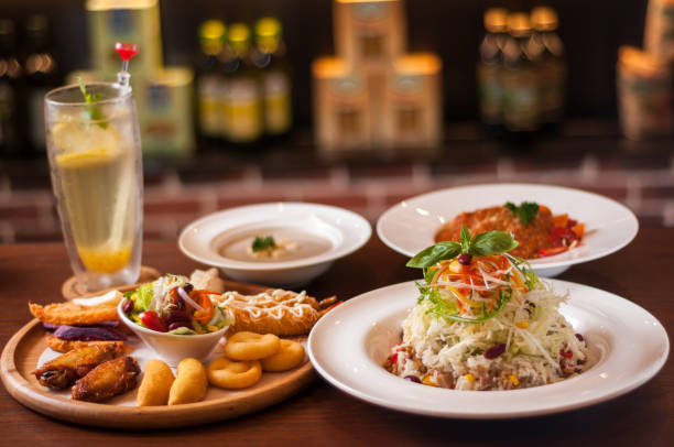 istock Snacks, fried rice, noodles, and mushroom soup on the table. 816774422