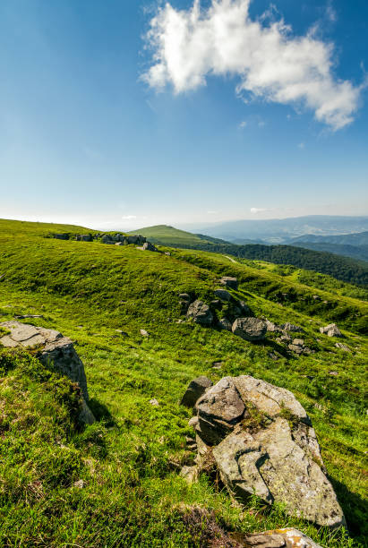 istock blue cloudy sky over the mountains with rocky hillside 816779668