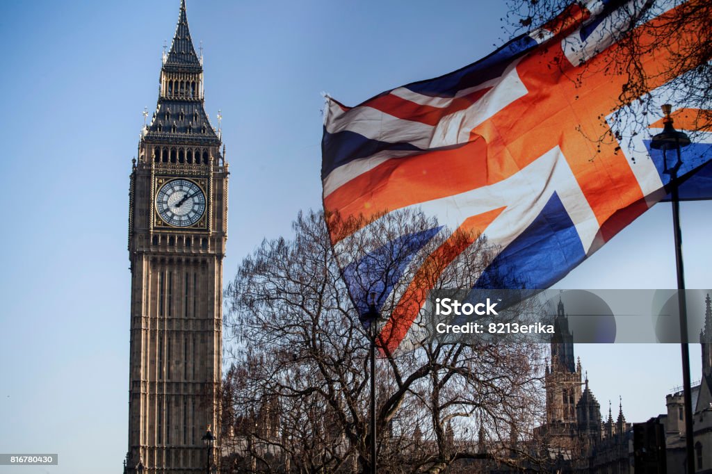 UK flag and Big Ben British union jack flag and Big Ben Clock Tower and Parliament house at city of Westminster in the background - UK votes to leave the EU, Brexit concept Architecture Stock Photo