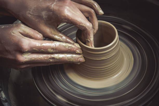 istock Creating vase of white clay close-up. Master crock. 816785546