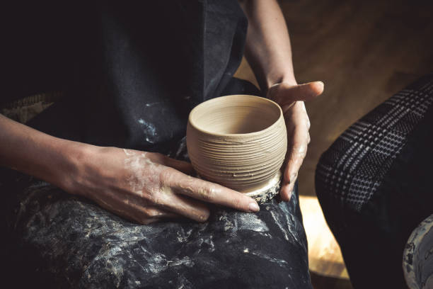 istock A raw clay pot in the hands of a potter 816785970