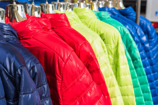 istock Winter clothes hanging at a store 816786432