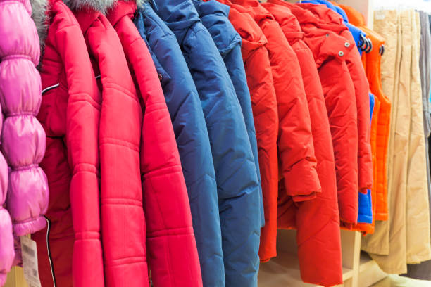 istock Winter clothes hanging at a store 816791922