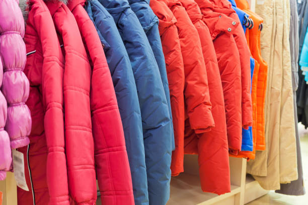 istock Winter clothes hanging at a store 816795256