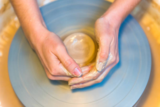 istock womens hands of a potter creating an earthen jar 816799194