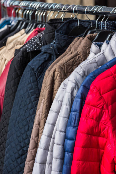 istock Winter clothes hanging at a store 816801656