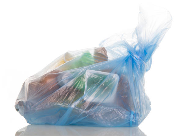 istock Blue plastic bag filled with household waste isolated on white. 816802562