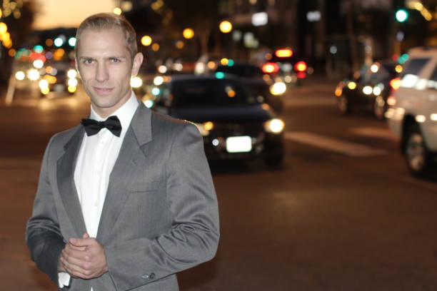 istock Elegant man smiling in the city at night 816806946