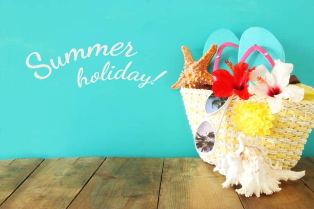 istock Beach objects on wooden table. Summer beach vacation concept 816819982