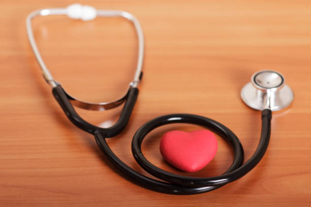 istock Medical stethoscope and red heart on the table. 816820126