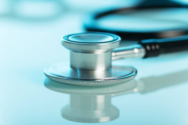 istock Medical stethoscope closeup on blue background. 816820136