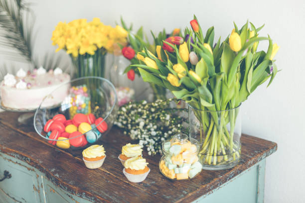 istock Bright macaroons and cupcakes on a wooden table 816827158
