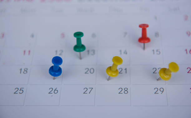 istock closeup colorful pins push marking on a calendar. busy schedule 816827388