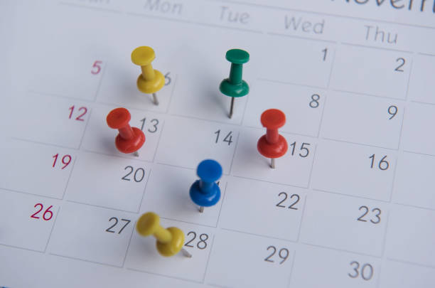 istock closeup colorful pins push marking on a calendar. busy schedule 816827392