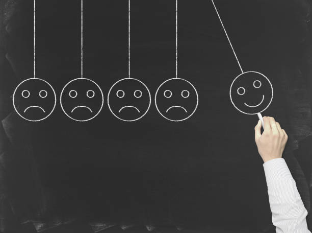 istock Newton's Cradle (Unhappy and happy smileys) - Business Chalkboard Background 816841282