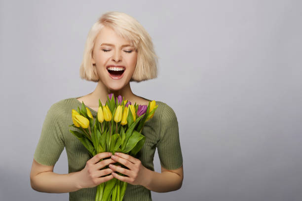 istock Woman holding flowers 816841344