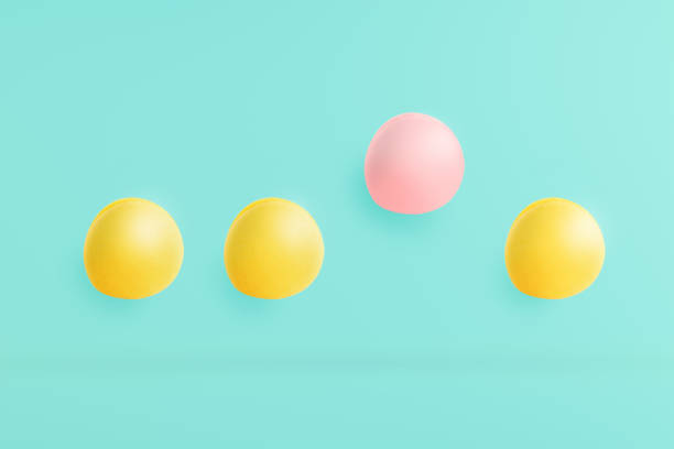 istock macarons on a blue background with pastels and pink highlights. The concept is differently harmonized in the object and used as a background on the web site. 816843992