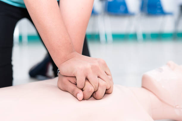 istock Nursing students are learning how to rescue the patients in emergency. CPR training with CPR doll. 816846598