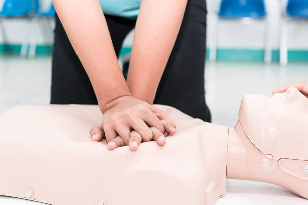 Nursing students are learning how to rescue the patients in emergency. CPR training with CPR doll. Nursing students are learning how to rescue the patients in emergency. CPR training with CPR doll. first aid class stock pictures, royalty-free photos & images