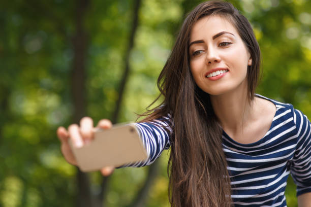 istock girl making selfie portrait 816847124