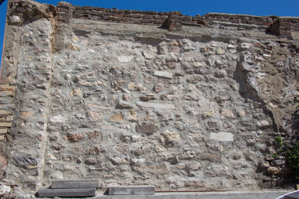 istock Wall made of the same type of stones 816852898