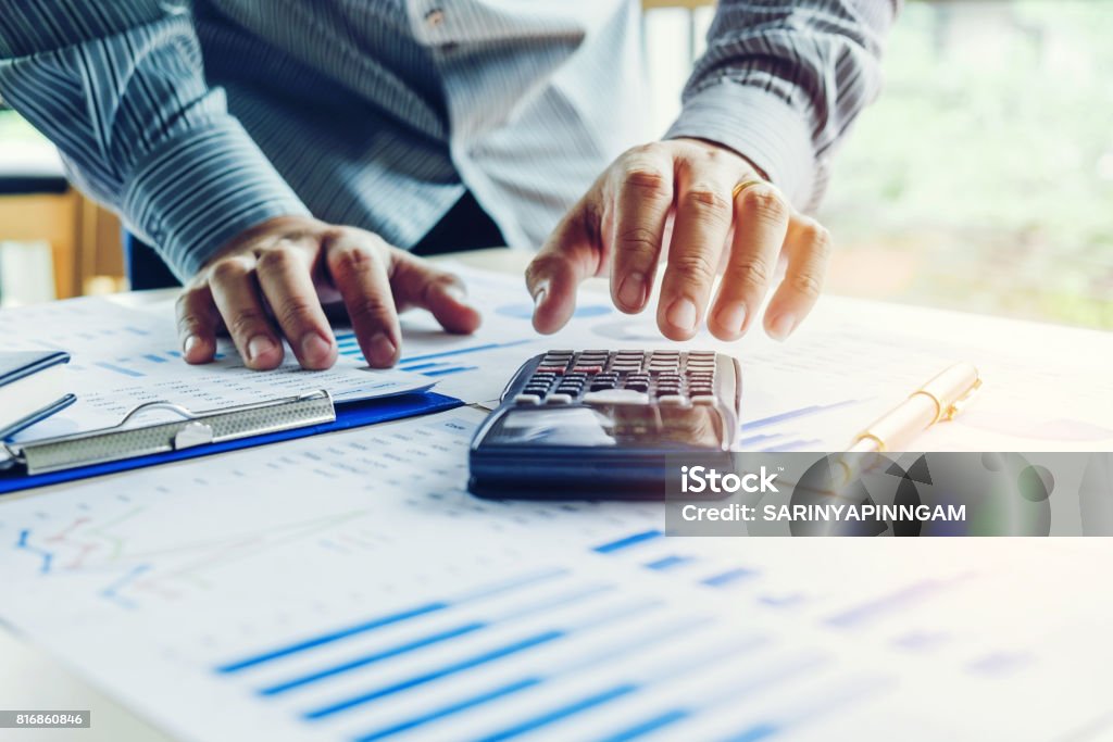 Business man Accounting Calculating Cost Economic Financial Loan Stock Photo