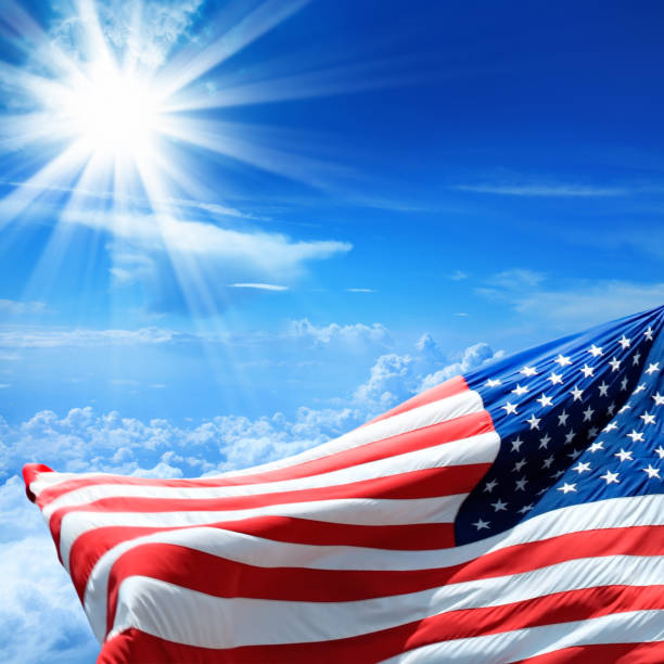 istock American flag and sunny sky 816863738