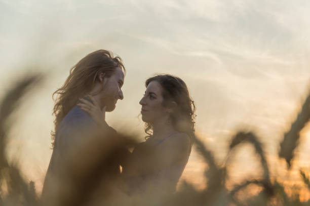 istock Young couple at grain field 816877048