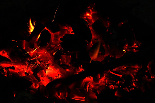 Hot sparking live-coals burning in a barbecue