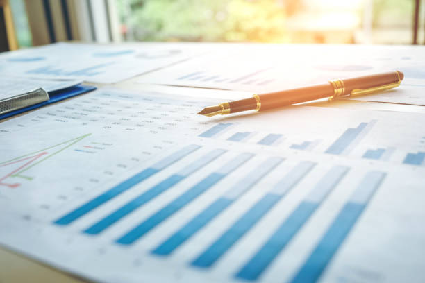 istock Pen  on the business paper. Report chart 816878990