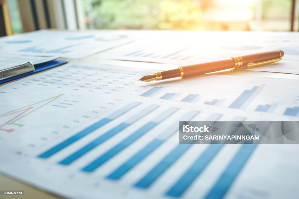 Pen  on the business paper. Report chart Planning Stock Photo