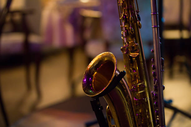 istock Saxophone on stage in jazz cafe 816890206