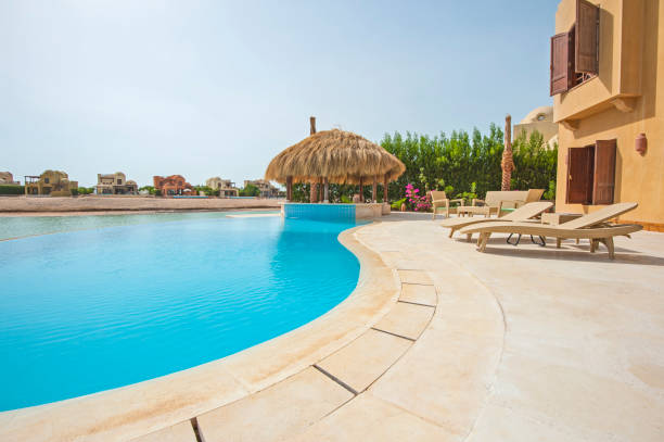 istock Swimming pool at at luxury tropical holiday villa 816897620