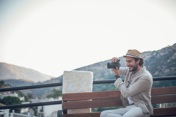 istock Tourist man making pictures with camera 816897622