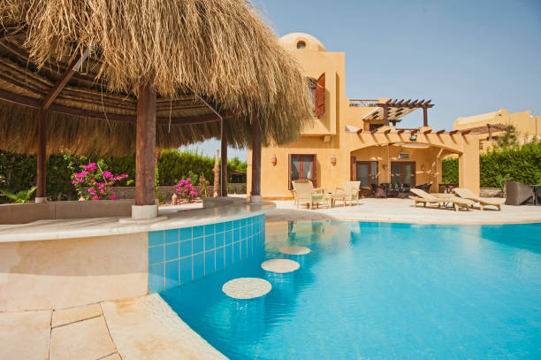 istock Swimming pool at at luxury tropical holiday villa 816897838