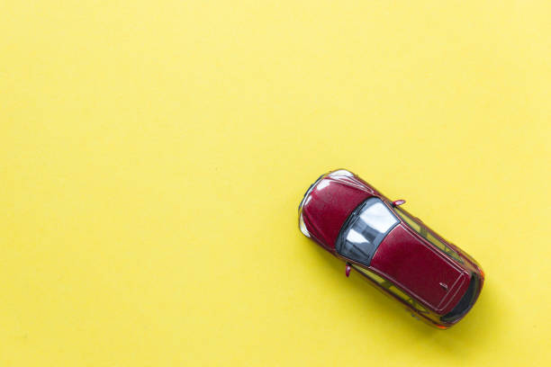 istock Car model on yellow background with copyspace, image can be used for car rental and car insurance concept 816898252