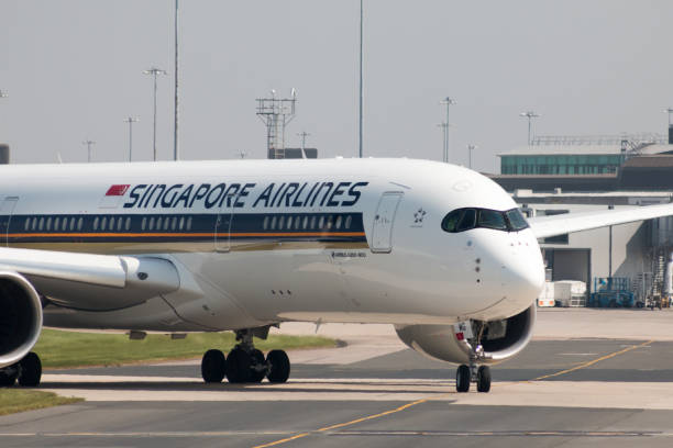 Manchester, United Kingdom - May 11, 2017: Singapore Airlines Airbus A350-900 passenger plane (9V-SMG) taxiing on Manchester International Airport tarmac.